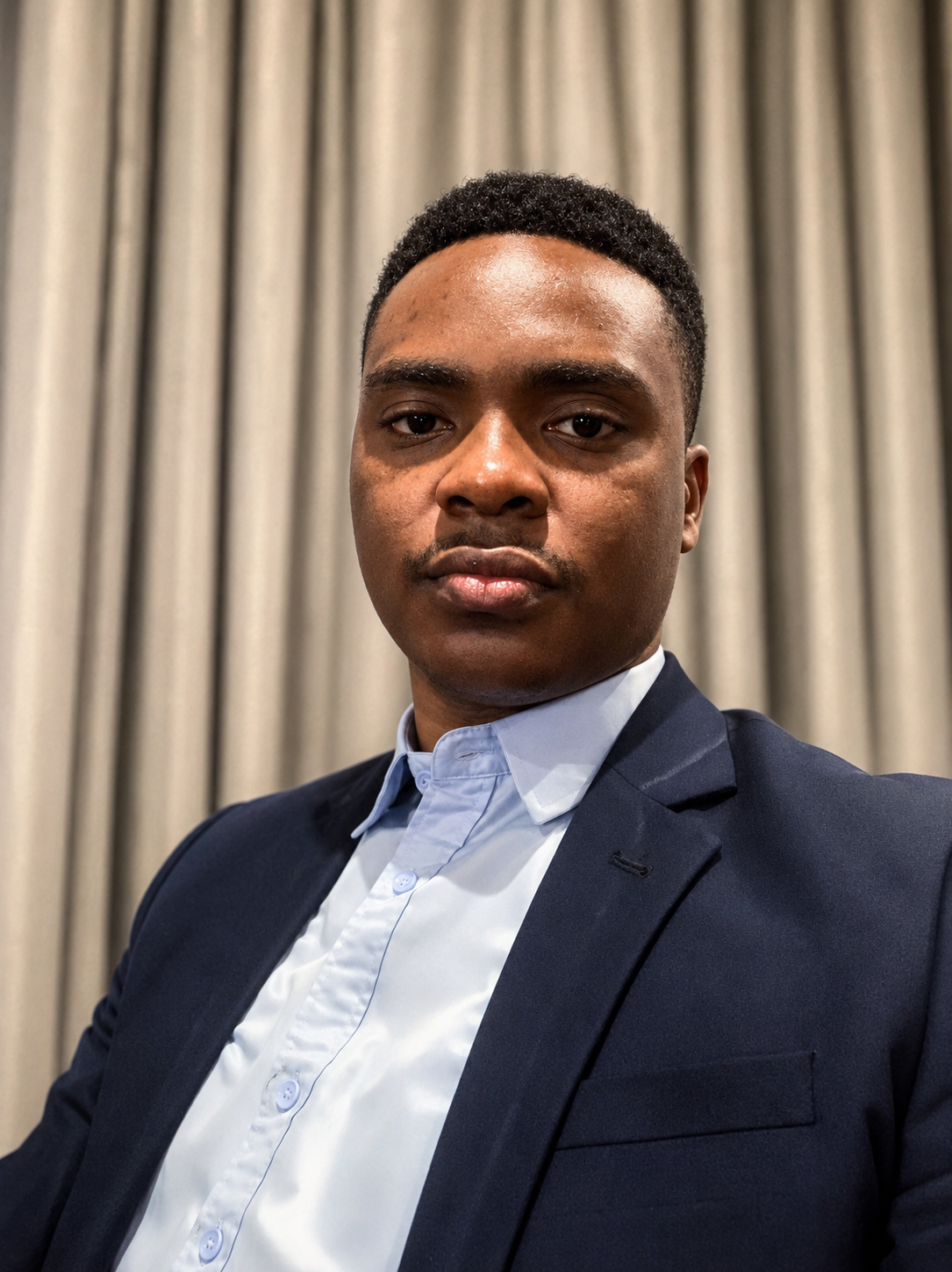 Oki Samuel - Company Secretary